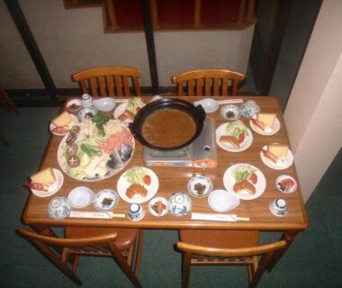 Table set for hot pot with assorted ingredients at Mizubaso ryokan in Gifu, Chūbu region