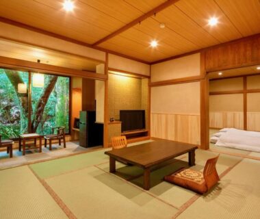 Traditional tatami room with low table, floor cushions and futon at Mizumari in Shizuoka Chubu