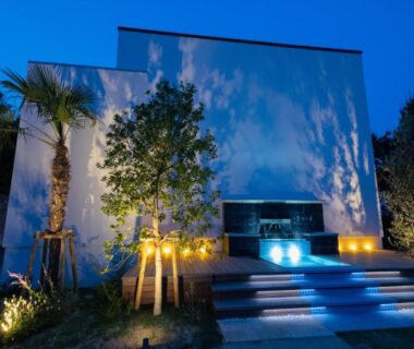 Illuminated minimalist entrance with steps and landscaping at Mizuno Ryokan in Saga, Kyushu, Japan