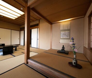 Traditional tatami room with tokonoma alcove, shoji screens and low table at Mizuno Ryokan, Saga