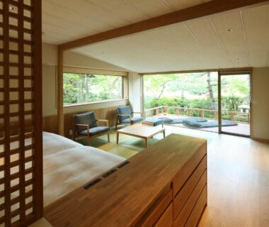 Spacious ryokan room with wooden interiors, shoji screen and garden view at Monjusou, Kyoto