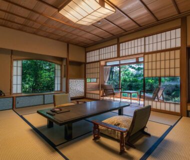 Tatami-floored room with low table and shoji screens at Monjusou Shourotei in Kyoto