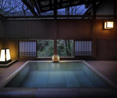 Wooden indoor onsen bath with shoji-style windows and garden view at Moritaya, Fukushima, Tōhoku