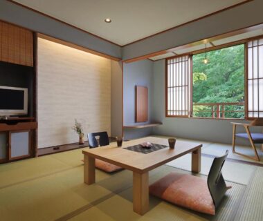 Traditional tatami room with low wooden table, cushions, shoji screens and garden view at Moritaya in Fukushima Tōhoku