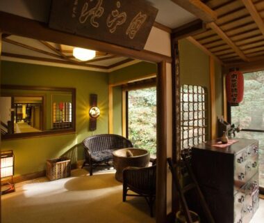 Tatami room with low seating and garden view at Motoyu Ishiya, Ishikawa, Chūbu, Japan
