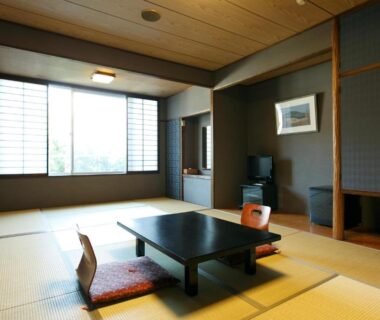 Tatami room with low table, floor seating cushions, shoji screens and wall alcove at Mount View Hakone, Kanagawa