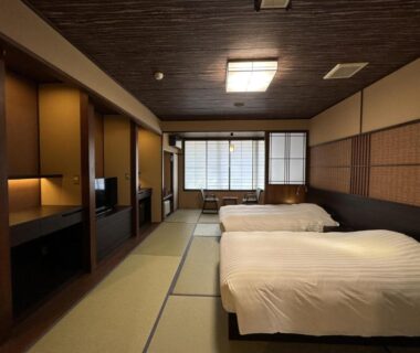 Tatami flooring with two Western beds, shoji screens and wooden accents at Mount View Hakone, Kanagawa, Japan