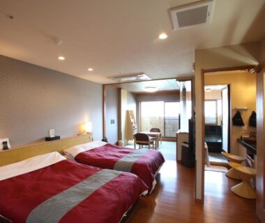 Twin beds with tatami seating and shoji screens at Mt Fuji Hanayagi no Sho Keizan, Yamanashi