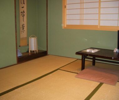 Traditional tatami room with low table, floor cushion, shoji screens and tokonoma alcove at Murataya in Ishikawa