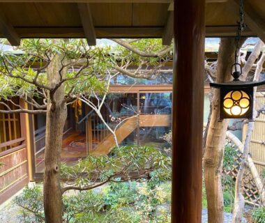 Wooden courtyard with lantern, shoji screens and garden at Muromachi Yutone Kyokoyado, Kyoto Kansai