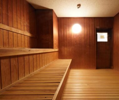 Interior of wooden sauna with tiered benches at Musashi ryokan in Wakayama Kansai
