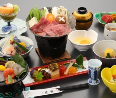 Assorted Japanese dishes on lacquer trays at Mutsumikan ryokan in Gifu, Chubu, Japan