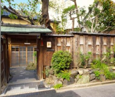 Traditional wooden gate and stone path at NAGOMI Kyoto Okazaki in Kyoto, Japan
