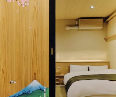 Tatami bedroom with painted Mount Fuji sliding panel and two low beds at NEW Hotel Komugi Skytree Tokyo