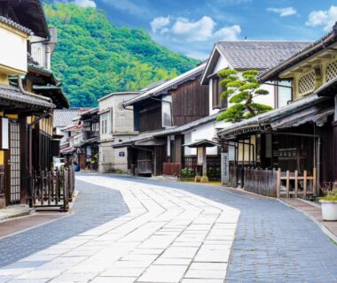 Paved street lined with traditional wooden buildings in Takehara saltworks town, Hiroshima, Japan