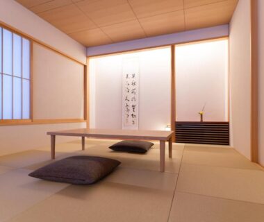 Tatami room with low table and cushions at NISEKO Inn of Youtei Raku Suisan, Hokkaidō Japan