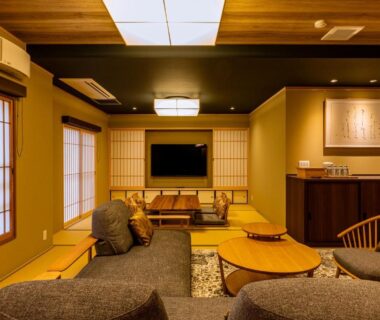 Cozy tatami lounge with low tables, shoji screens and wooden accents at NISHIYAMA RYOKAN in Kyoto
