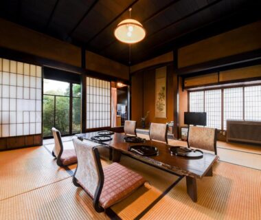 Low table, floor chairs and shoji screens in a tatami room at Nagataki ryokan, Gifu