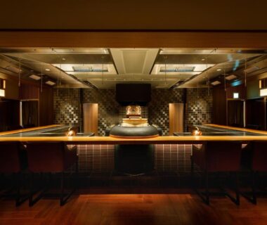 Intimate wooden bar counter with stools and ambient lighting inside Nakanobo Zuien, Hyōgo