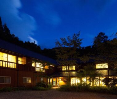 Lit exterior at dusk with wooden facade and surrounding trees at Nakaodaira in Gifu, Chūbu