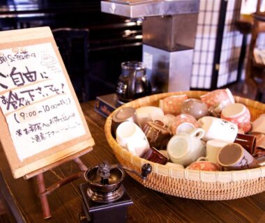 Basket of assorted ceramic teacups on counter at Nakaya Ryokan in Gunma