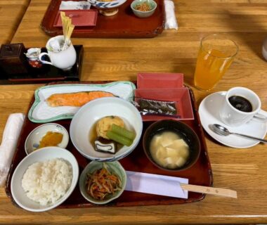 Rice, grilled fish, miso soup, side dishes, orange juice and coffee at Nakayasu Ryokan Ishikawa