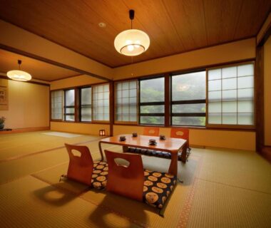 Tatami room with low table and shoji windows at Namegawaonsen Fukushimaya in Yamagata