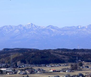 Distant mountain range above rural village near Nanpeidai Onsen Hotel, Tochigi
