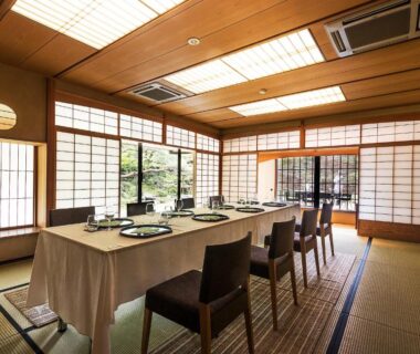 Tatami dining room with low tables, chairs and shoji screens at Nanzenji sando KIKUSUI, Kyoto ryokan