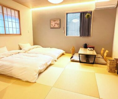 Bright tatami room with futon bedding, shoji screens and low table at Nara Inn in Nara, Kansai