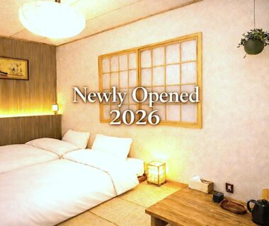 Tatami room with low twin beds, shoji screen, low table and teapot at Nara Inn in Nara, Kansai