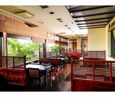 Wooden partitioned dining area with large windows and garden view at Nara Park Hotel Nara Kansai