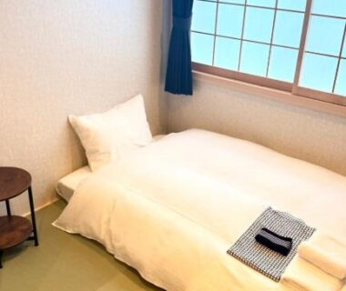 Tatami room with futon, shoji window and side table at Nara Ryokan in Nara, Kansai