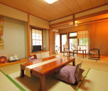 Traditional tatami room with low table, shoji screens and garden view at Nasu Hoshi no Akari in Tochigi, Kantō