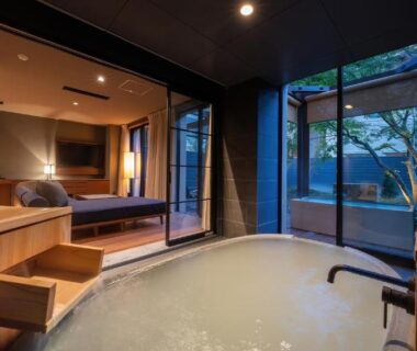 Wooden in-room bath with sliding doors to small courtyard at Nasu-Onsen Shinshun no Kago, Tochigi
