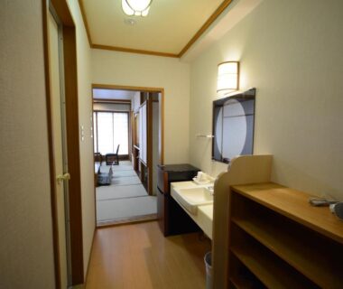 Corridor with vanity leading to tatami room at Nasushiobara Ichimantei in Tochigi, Kantō, Japan