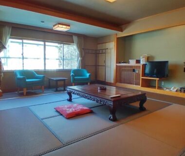 Tatami room with low table and seating at Nasushiobara Masudaya in Tochigi, Kanto, Japan