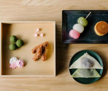 Assorted wagashi and dango on wooden trays at Nazuna Kyoto Gosho in Kyoto