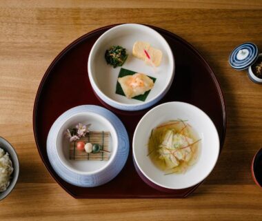 Tray with small Japanese dishes and rice at Nazuna Kyoto Higashi Honganji in Kyoto