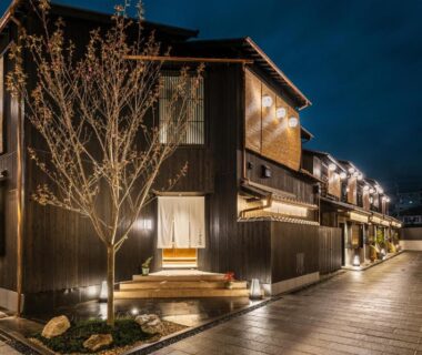 Wooden facade and lantern-lit walkway at Nazuna Kyoto Tsubaki St, Kyoto