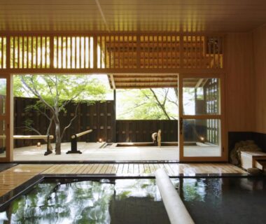 Indoor wooden onsen bath with garden view through shoji at Negiya Ryofukaku, Hyōgo