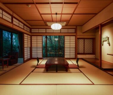 Traditional tatami room with low table, shoji screens and garden view at Negiya Ryofukaku in Hyōgo