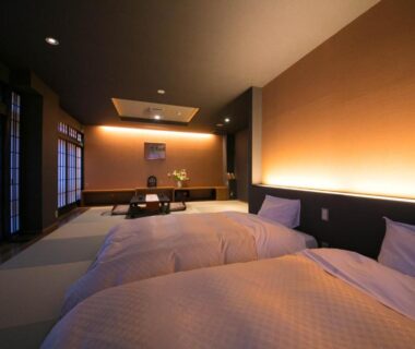 Tatami flooring with twin beds, shoji screens and low table at New Ogiya, Fukushima Tōhoku