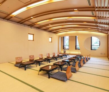 Spacious tatami dining room with low tables and cushions at New Welcity Yugawara, Shizuoka, Chūbu, Japan