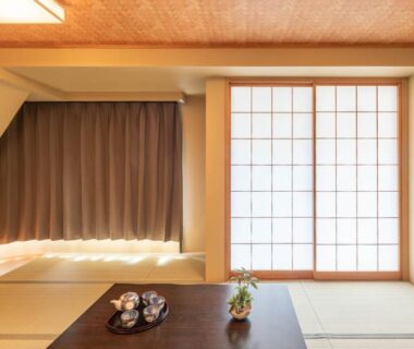Traditional tatami room with shoji screens and a low tea table at Nihonbashi Kakigara Ryokan Tokyo