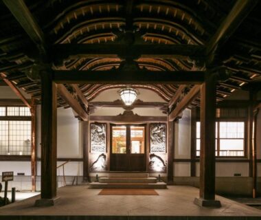 Wooden entrance with carved beams and hanging lantern at Nikko Kanaya Hotel in Tochigi, Kantō Japan