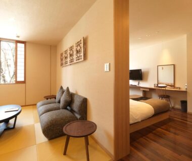 Guest room with tatami seating and bed at Niseko Konbu Onsen Tsuruga Moku-no-sho, Hokkaidō