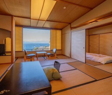 Traditional tatami room with low table, zabuton cushion and futon at Nishiizu Koyoi, Shizuoka, Chūbu