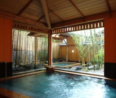Covered wooden onsen bath opening to bamboo garden at Nishimuraya Honkan in Hyōgo, Kansai