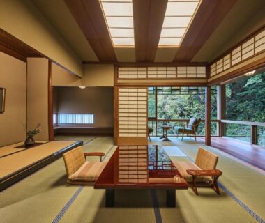 Tatami room with low table, shoji screens and garden view at Nishimuraya Honkan in Hyōgo, Kansai